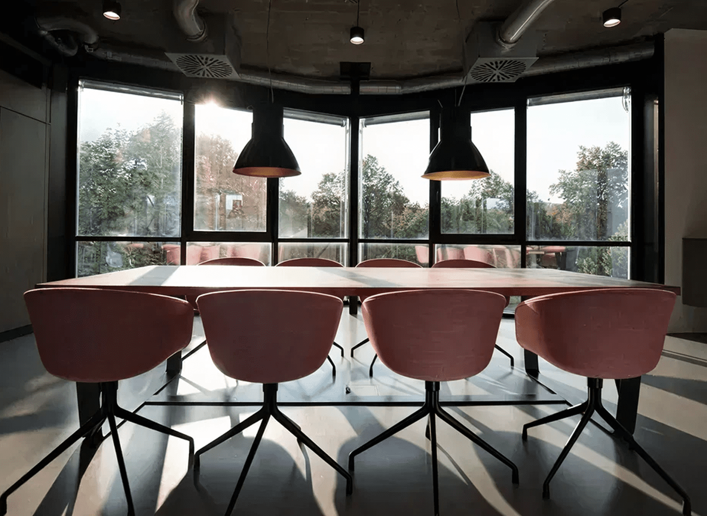 Modern conference room with pink chairs